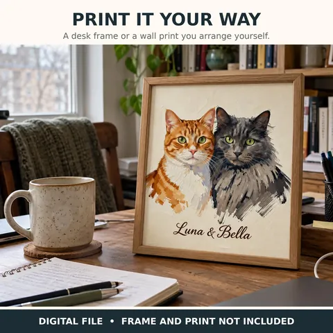 Two-cat portrait displayed in a frame beside a mug